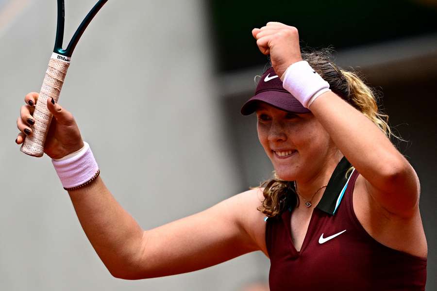 Mirra Andreeva celebrates her victory over Daria Kasatkina
