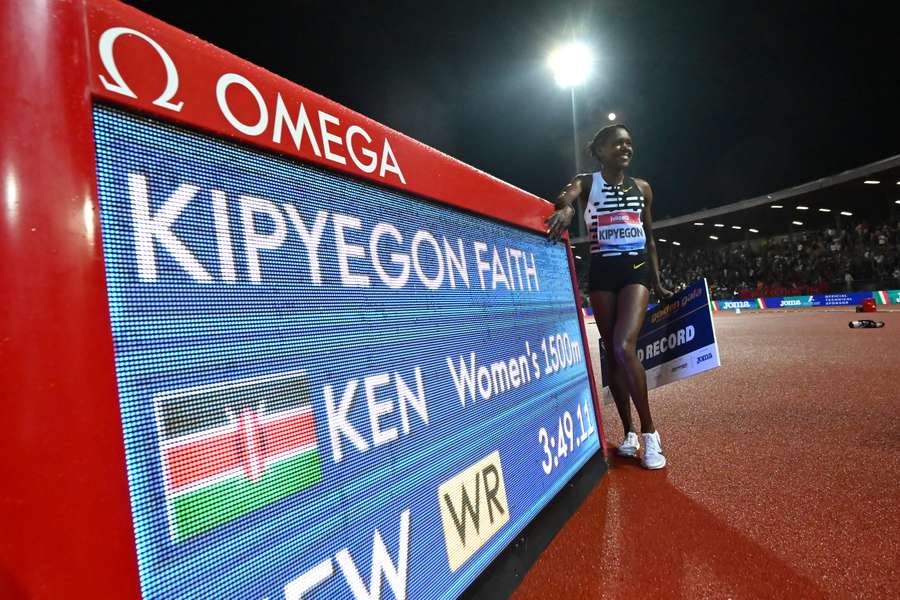 Kenya's Faith Kipyegon poses after winning the 1500m in a world record time