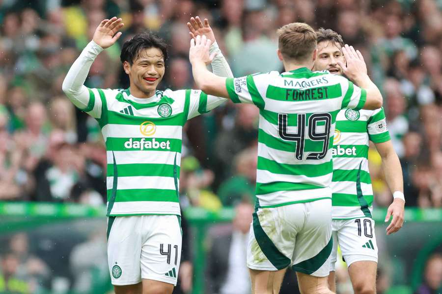 Celtic's Reo Hatate celebrates with teammate James Forrest