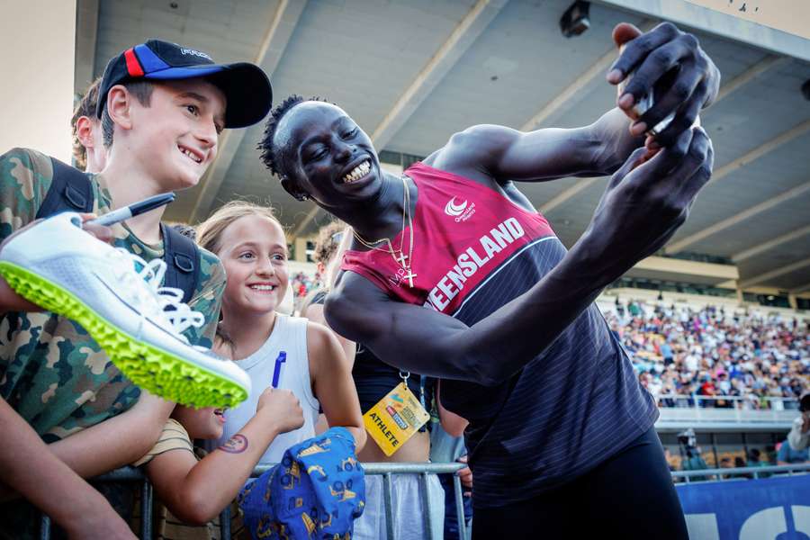 Gout Gout takes a selfie with some young fans at last month's junior nationals in Brisbane.