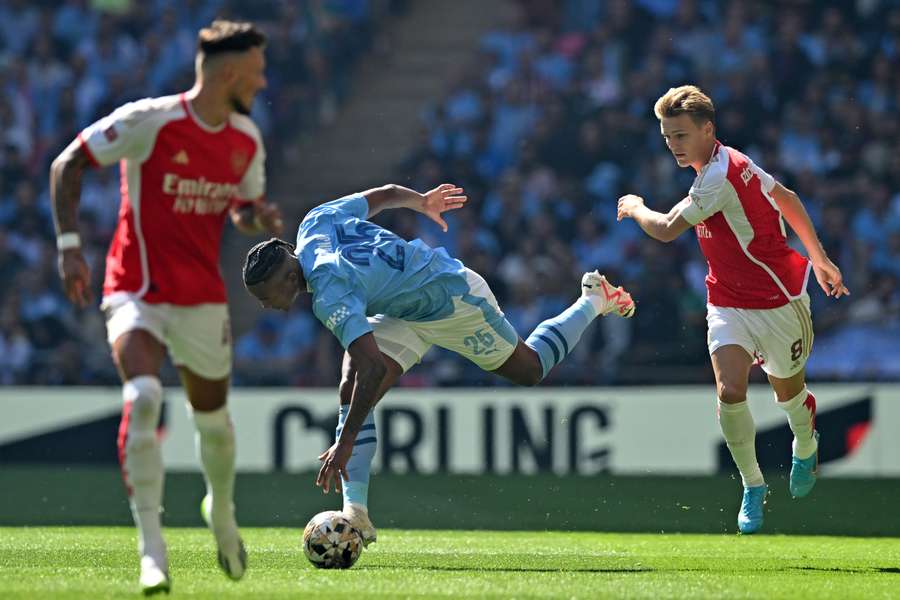 Manuel Akanji (L) and Martin Odegaard battle for the ball Manuel Akanji (L) and Martin Odegaard battle for the ball