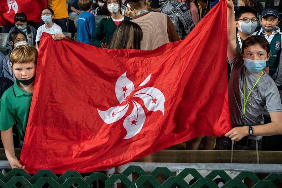 Rugby fans hold the flag of Hong Kong