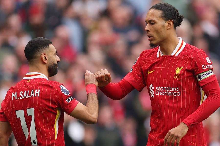 Mohamed Salah of Liverpool celebrates scoring with teammate Virgil van Dijk