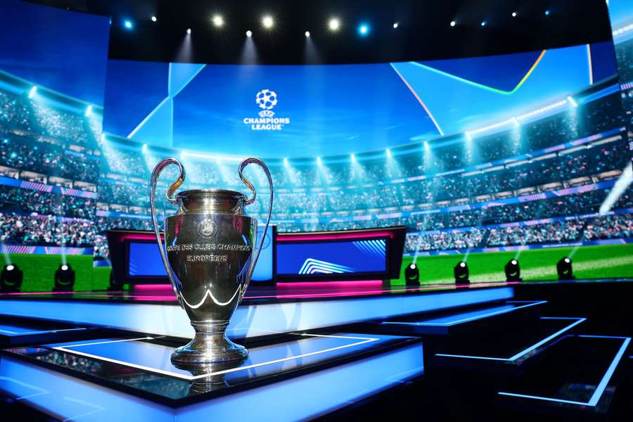 The UEFA Champions League trophy is displayed ahead of the draw The UEFA Champions League trophy is displayed ahead of the draw