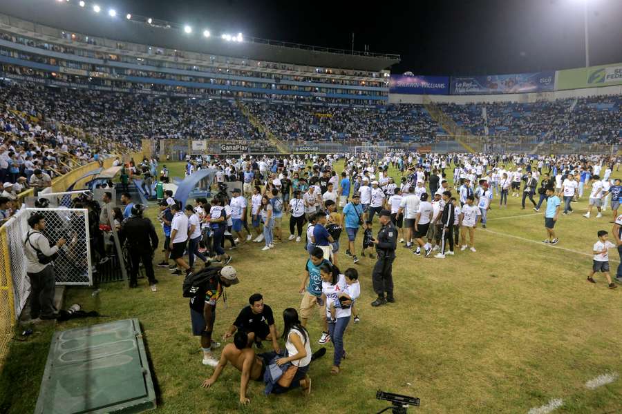 A stampede at a football stadium in El Salvador's capital kills 12 people and injures hundreds