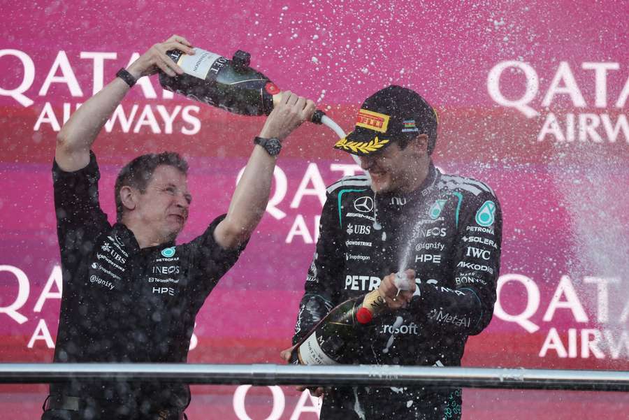 George Russell celebrates on the podium after winning the race in Baku George Russell celebrates on the podium after winning the race in Baku