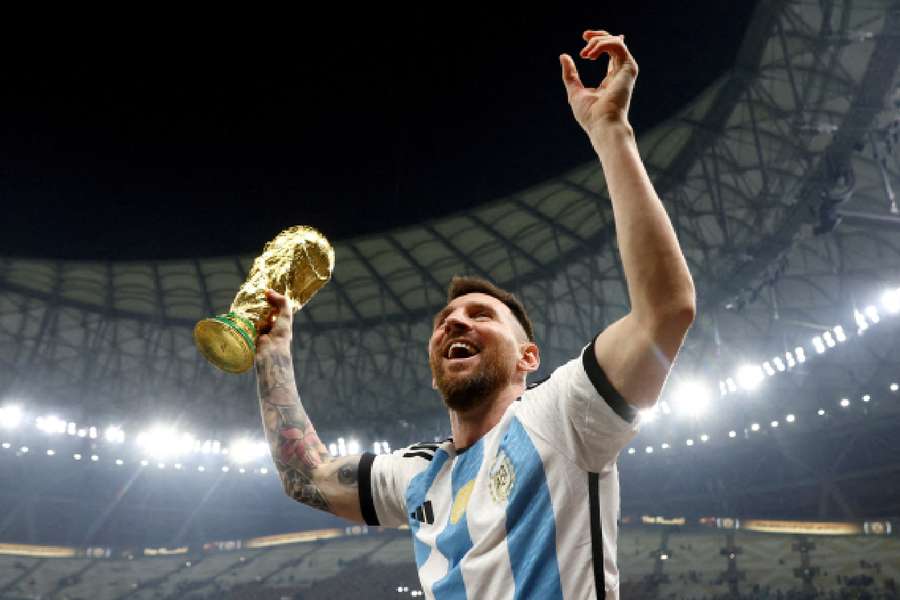 Messi celebrates with the World Cup