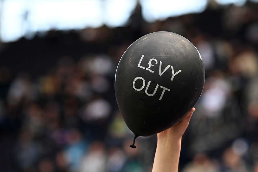 Fans hold a protest balloon calling for Tottenham Hotspur's English chairman Daniel Levy to leave the club after the English Premier League football match between Tottenham Hotspur and Brentford