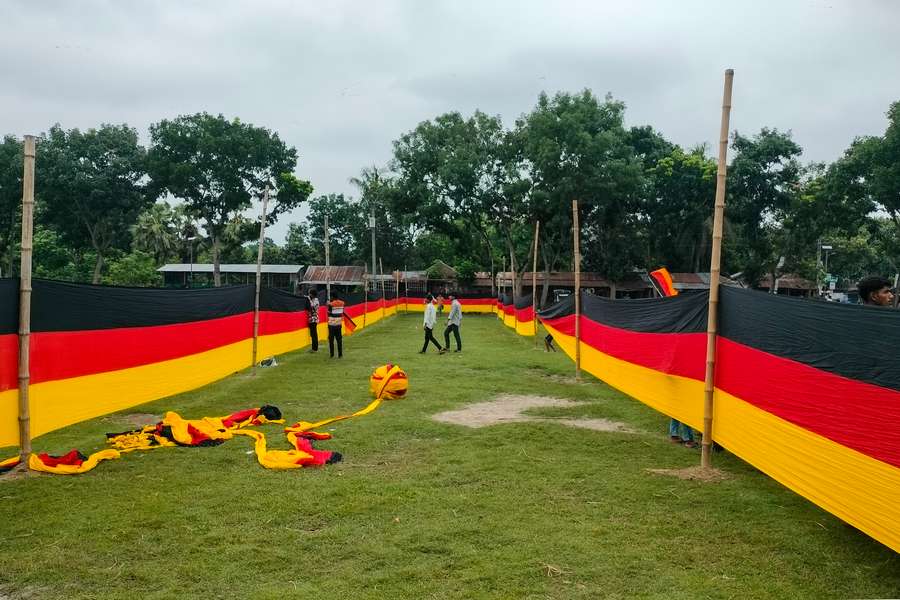 People look at the vast national flag of Germany People look at the vast national flag of Germany