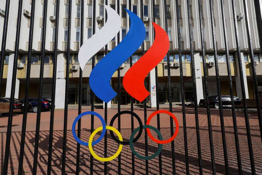 A view through a fence shows the Russian Olympic Committee headquarters in Moscow