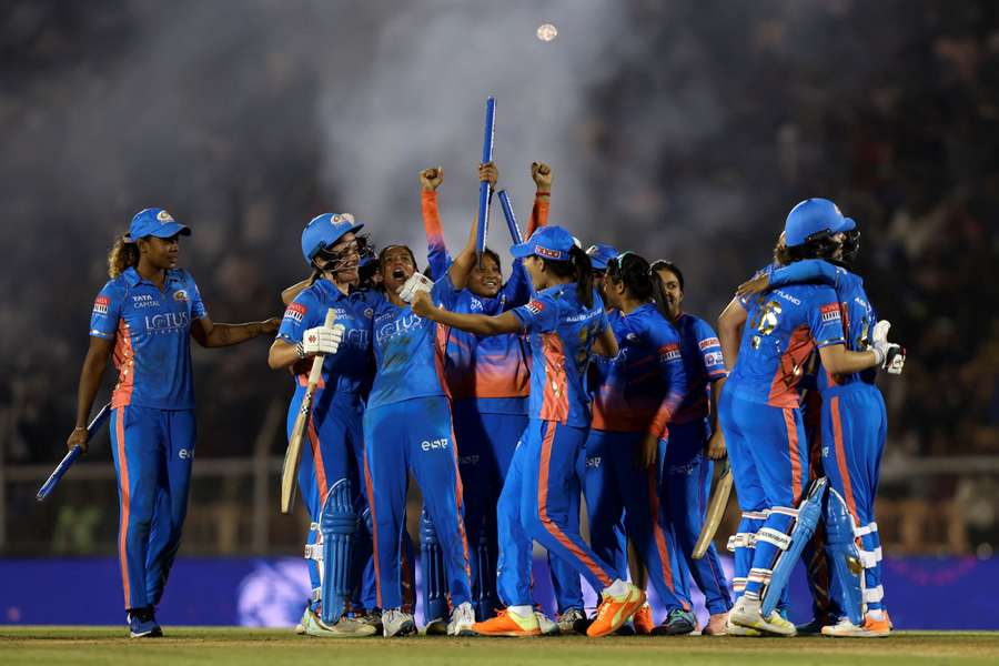 Mumbai Indians celebrate the inaugural championship victory 