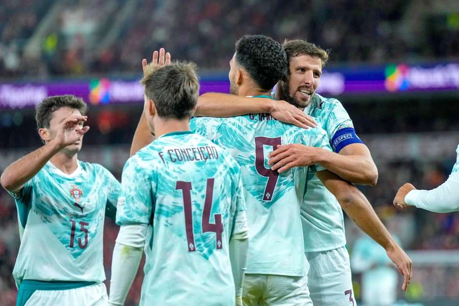Portugal's Goncalo Ramos celebrates scoring their second goal with Ruben Dias, Francisco Conceicao and Joao Neves