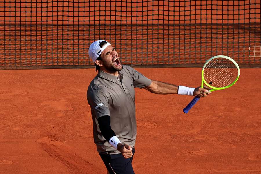 Matteo Berrettini celebrates after securing the victory