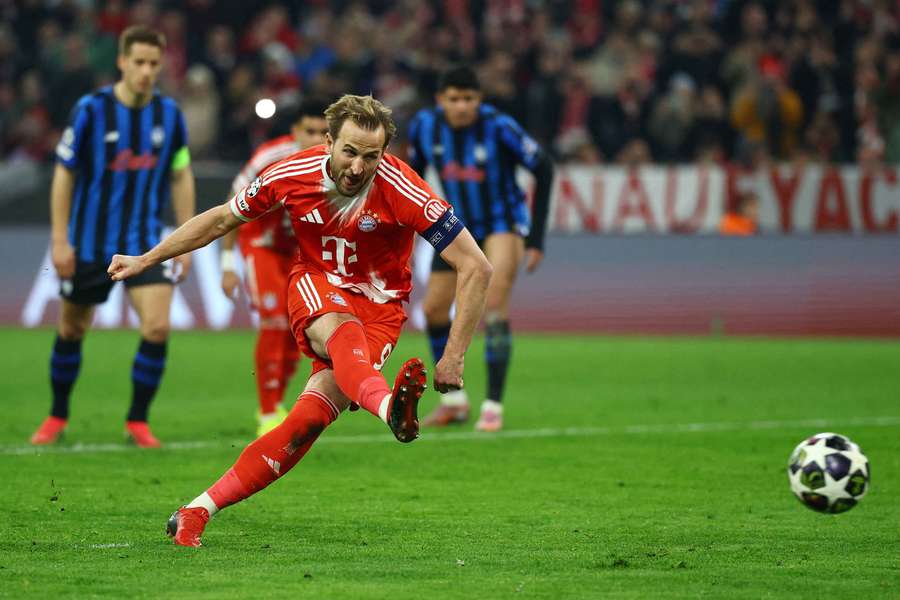 Bayern Munich's Harry Kane scores their first goal from the penalty spot 