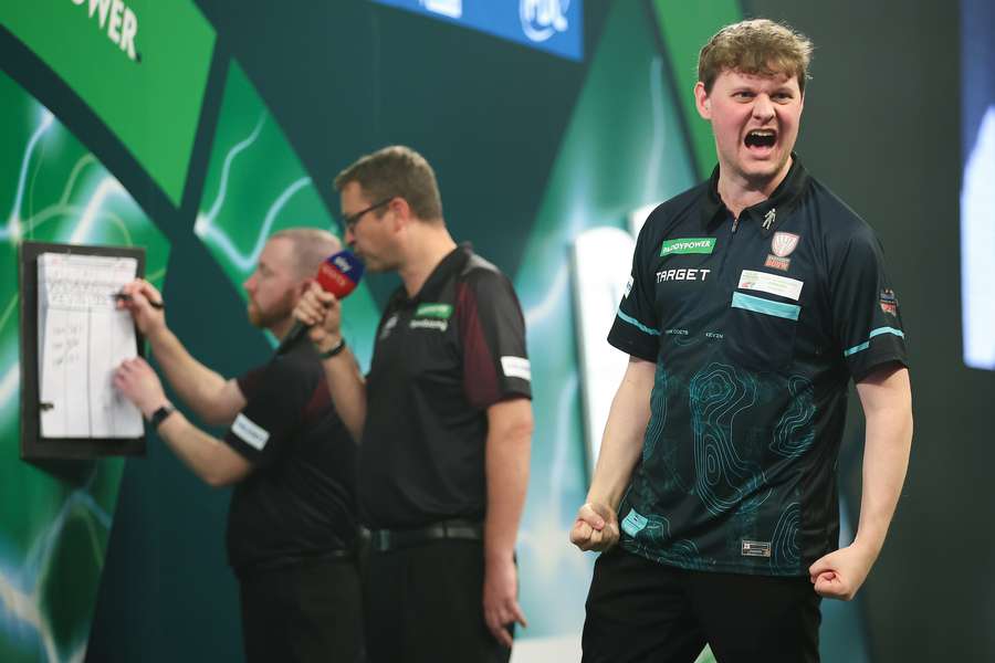 Kevin Doets celebrates during his PDC World Darts Championship match against Nathan Aspinall Kevin Doets celebrates during his PDC World Darts Championship match against Nathan Aspinall