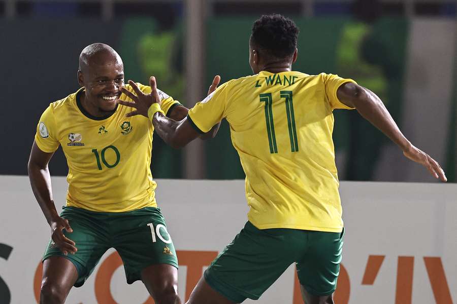 South Africa's Themba Zwane (R) celebrates with teammates after scoring his team's third goal