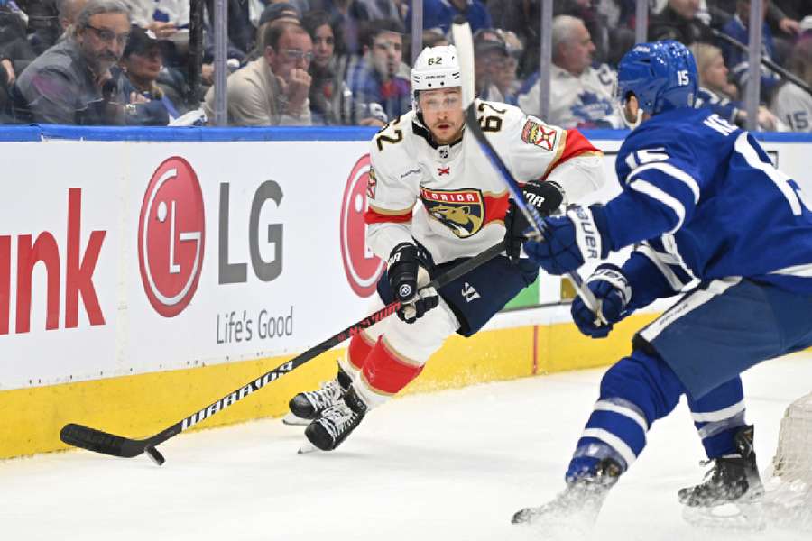 Panthers defenceman Montour skates with the puck against Maple Leafs forward Kerfoot