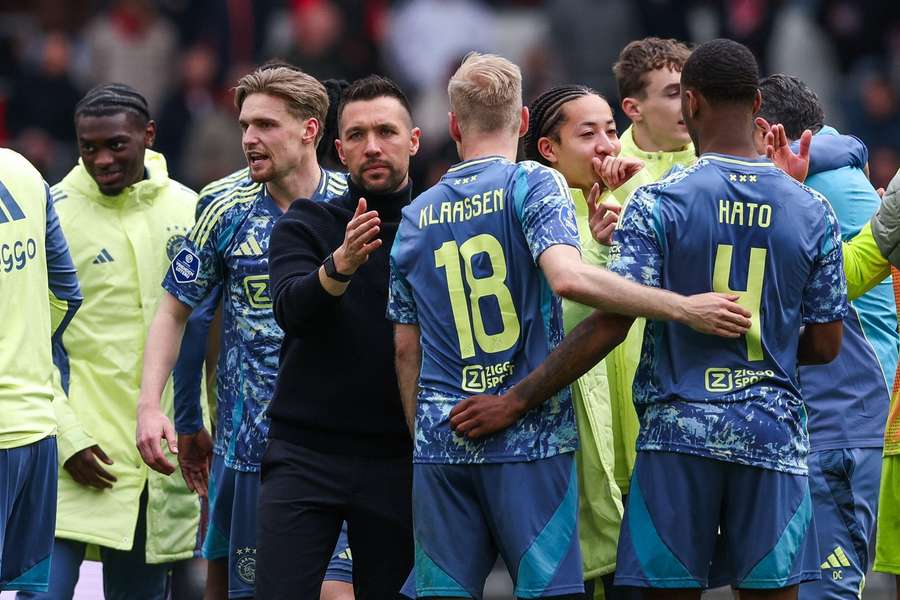 Ajax manager Francesco Farioli celebrates the 2-0 away win at PSV with his players