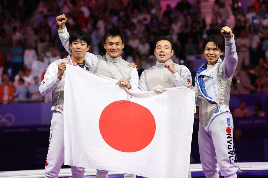 De gouden Japanse mannen uit het teamschermen