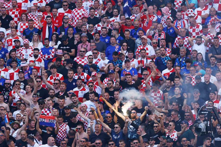 Croatia fans let off a flare in the stands
