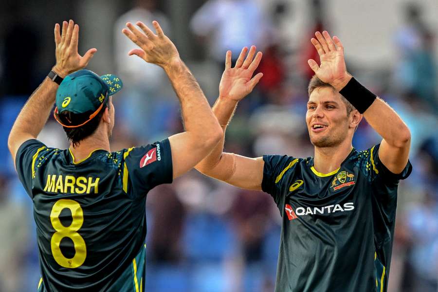 Australia's Aaron Hardie (right) celebrates with Mitchell Marsh after taking the wicket of Bangladesh's Towhid Hridoy during the second T20