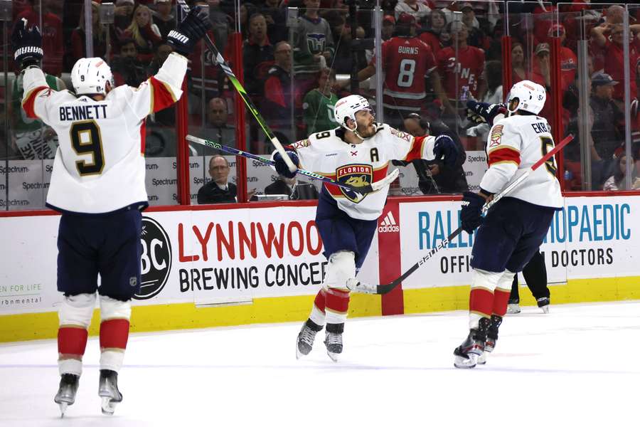 Matthew Tkachuk of the Florida Panthers celebrates with his teammates after scoring the game-winning goal