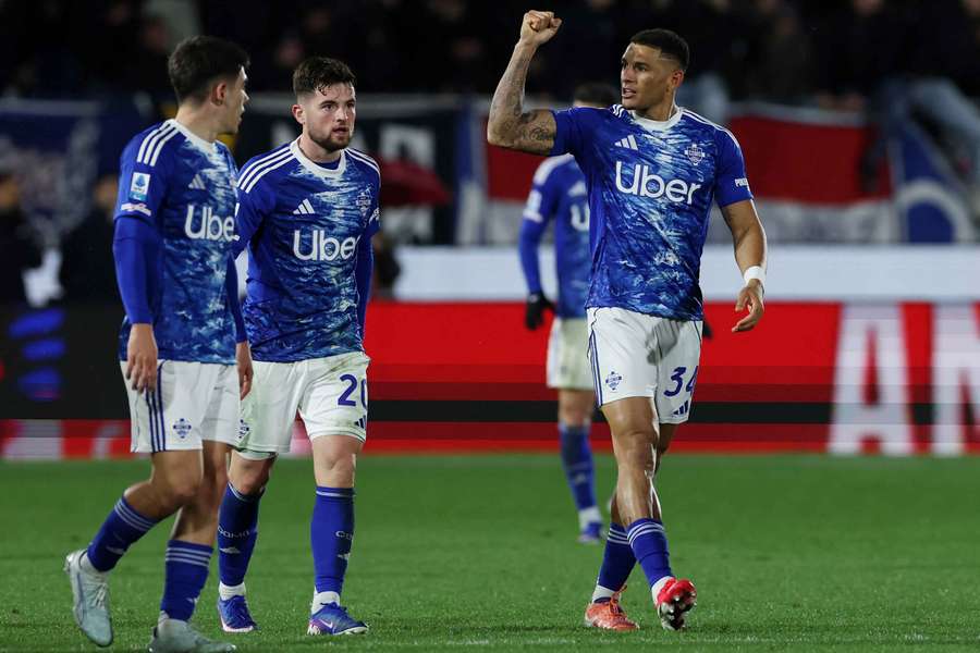 Como's Diego Carlos celebrates scoring their second goal against Roma Como's Diego Carlos celebrates scoring their second goal against Roma