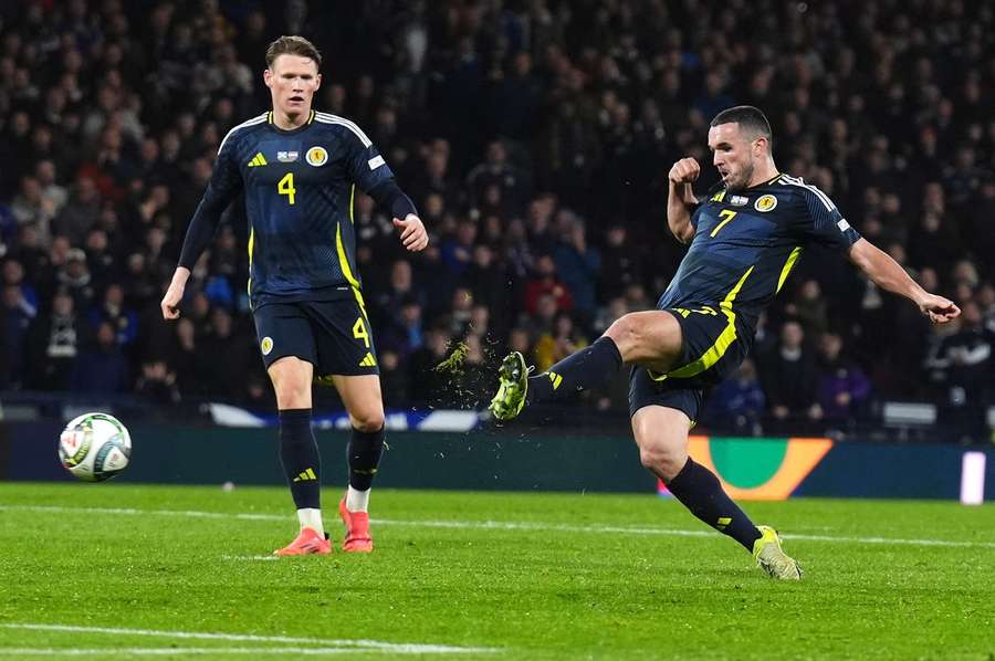 Scotland's John McGinn (right) scores their side's goal