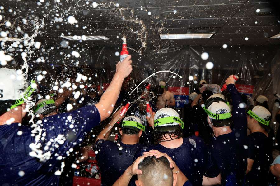 The LA Dodgers celebrate winning the NL West. The LA Dodgers celebrate winning the NL West.