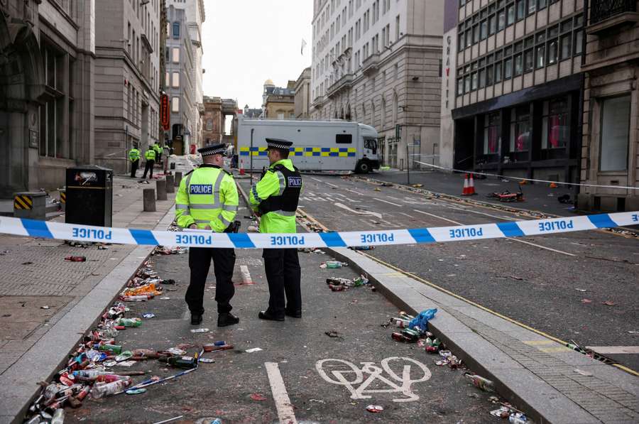Police officers work at the scene after the Liverpool parade incident Police officers work at the scene after the Liverpool parade incident