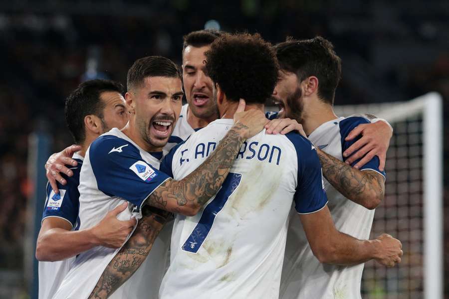 Felipe Anderson is embraced by his teammates after scoring the only goal of the game