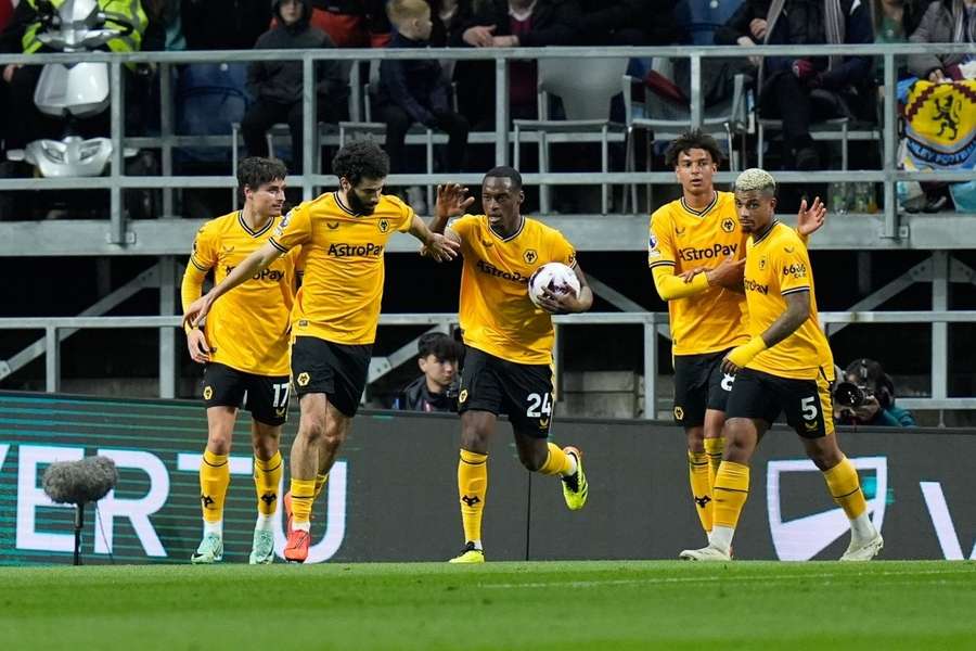 Matheus Cunha (not in picture) scores their side's first goal of the game from a corner kick