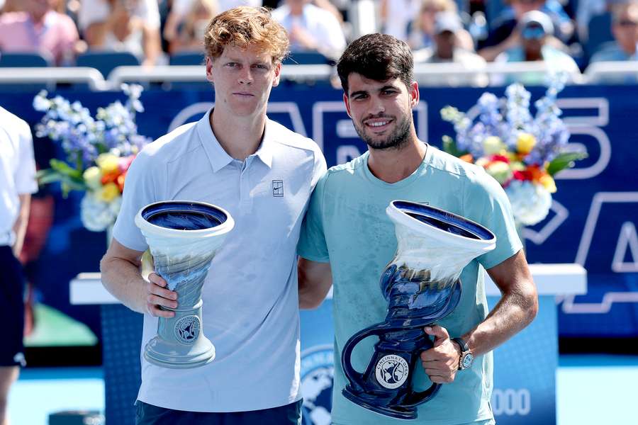 Jannik Sinner of Italy and Carlos Alcaraz of Spain pose with their Rookwood Cups after the men's final of the Cincinnati Open Jannik Sinner of Italy and Carlos Alcaraz of Spain pose with their Rookwood Cups after the men's final of the Cincinnati Open