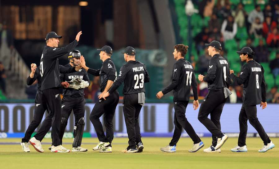 New Zealand's Mitchell Santner celebrates with teammates after taking the wicket of South Africa's Temba Bavuma, caught out by Kane Williamson New Zealand's Mitchell Santner celebrates with teammates after taking the wicket of South Africa's Temba Bavuma, caught out by Kane Williamson