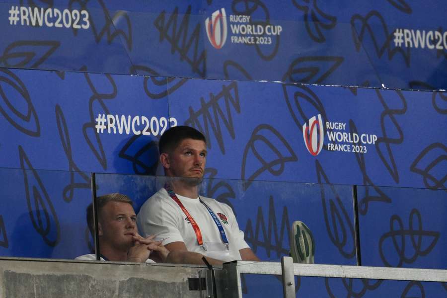 England's Owen Farrell looks on from the stands