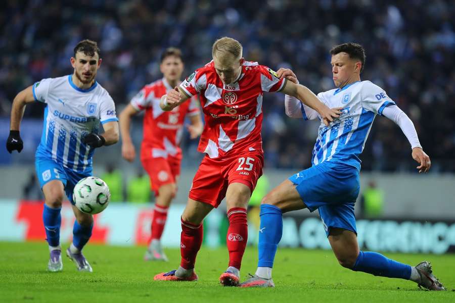 Andreas Hanche-Olsen of Mainz is challenged Andreas Hanche-Olsen of Mainz is challenged