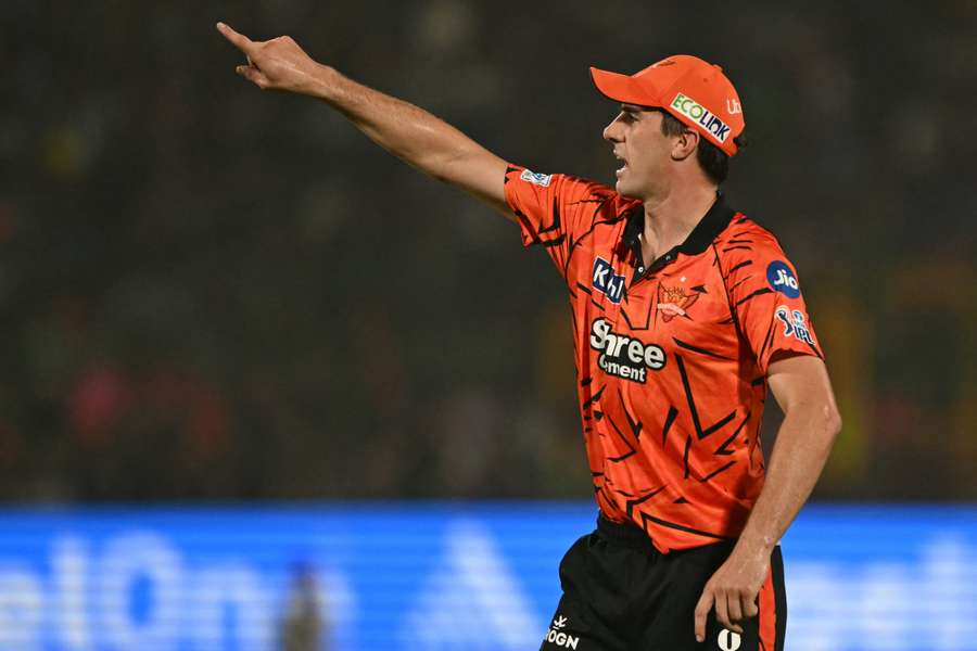 Sunrisers Hyderabad captain Pat Cummins directs his fielders.
