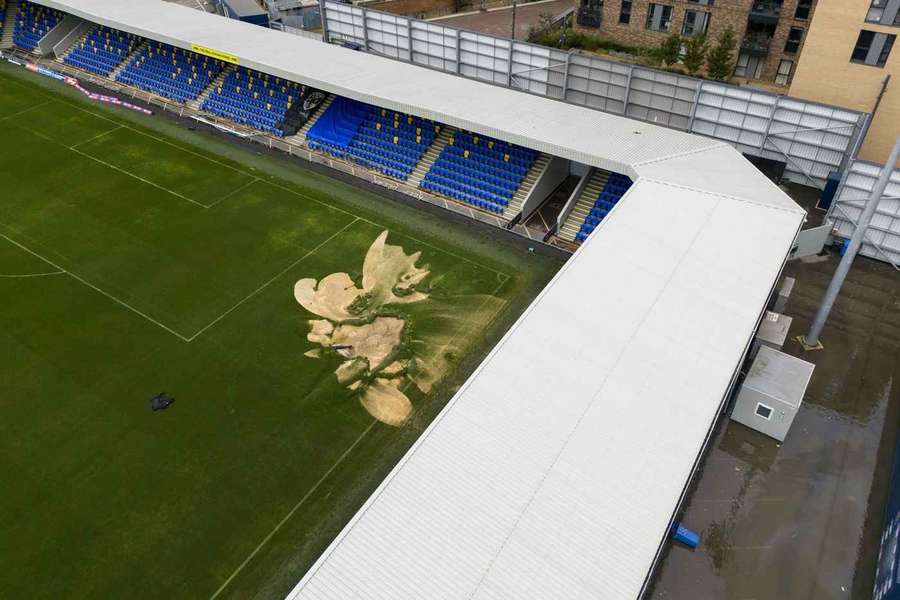 A sinkhole on the pitch and flooded walkways at AFC Wimbledon's Cherry Red Records Stadium