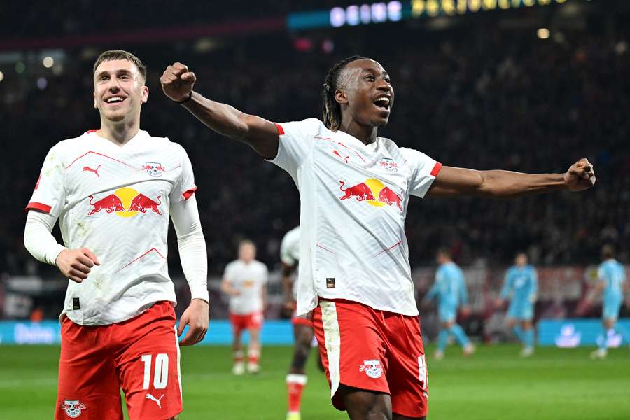 Brajan Gruda (left) of RB Leipzig celebrates scoring his team's fourth goal of the game with Yan Diomande