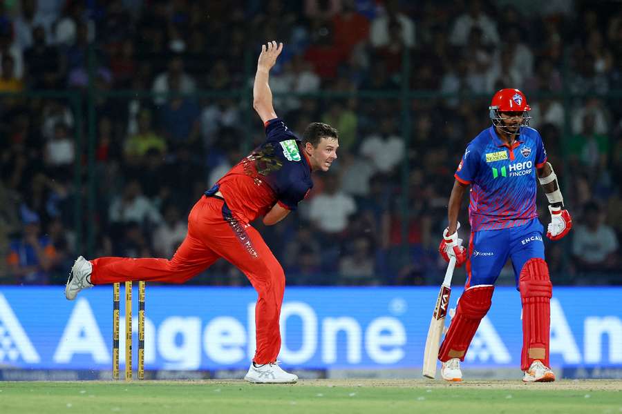 Josh Hazlewood sends down a delivery against the Delhi Capitals on Monday.