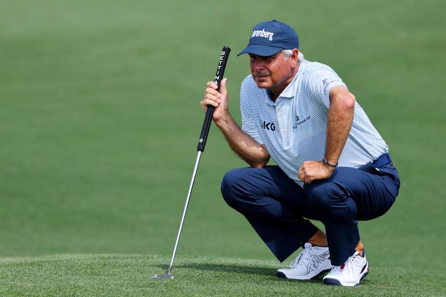 Fred Couples lines up a putt at Augusta