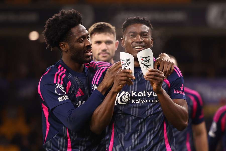 Awoniyi (R) celebrates his first goal of the season