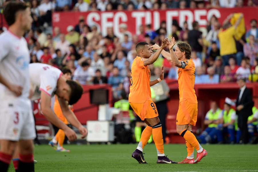 Kylian Mbappe celebrates with Luka Modric after scoring the opening goal on Sunday