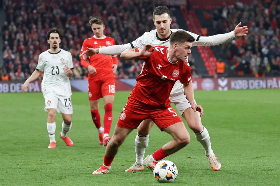 Joachim Maehle tries to cover the ball in the first game between the two countries