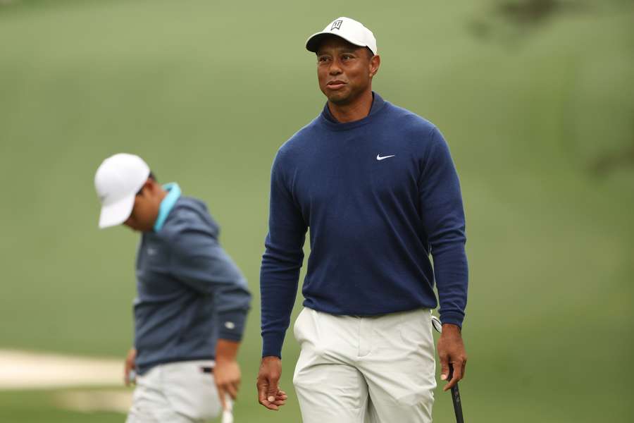 Tiger Woods of the United States looks on from the tenth green during a practice round prior to the 2023 Masters Tournament at Augusta National Golf Club