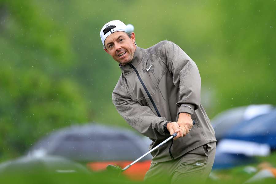 Rory McIlroy of Northern Ireland reacts after hitting his tee shot at the 17th hole into the left rough during the third round of the PGA Championship