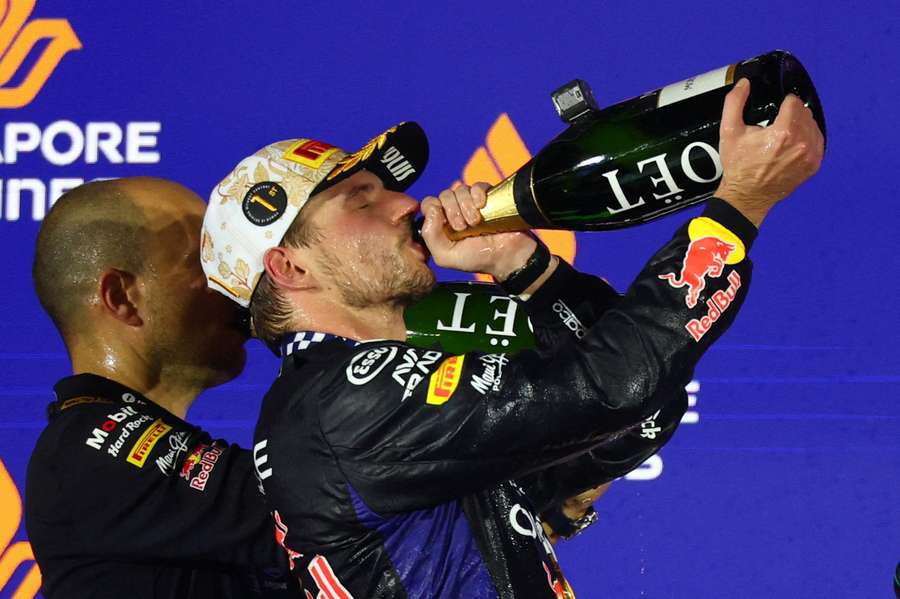 Max Verstappen celebrates on the podium after winning the Singapore Grand Prix Max Verstappen celebrates on the podium after winning the Singapore Grand Prix