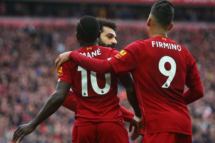 Firmino, Mané und Salah feiern gemeinsam einen Treffer.