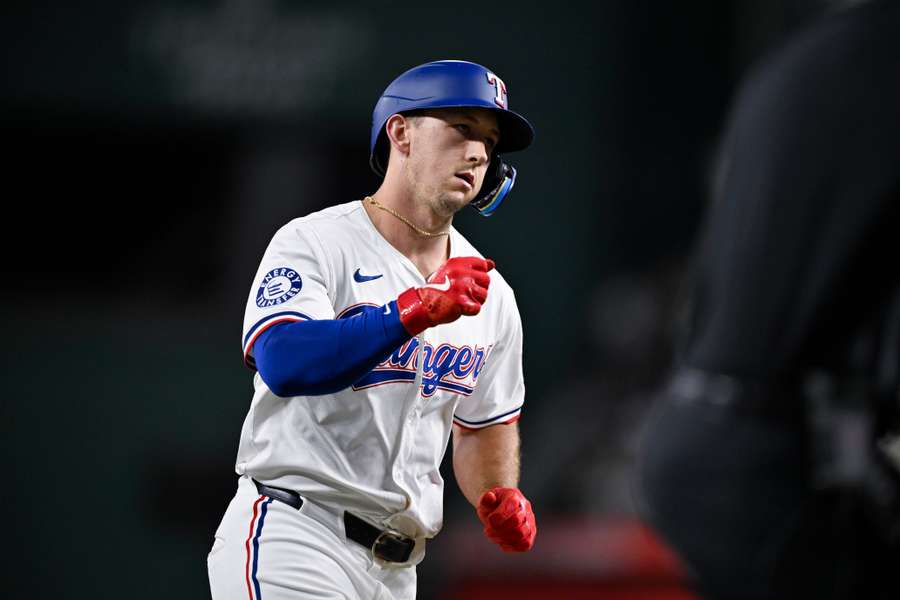 Texas Rangers left fielder Wyatt Langford rounds the bases after he hits a two-run home run during the seventh inning against the New York Yankees