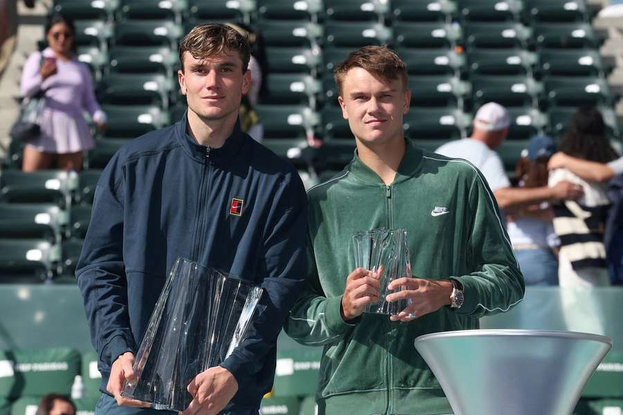 Jack Draper of Great Britain and Holger Rune of Denmark pose with their trophies at Indian Wells